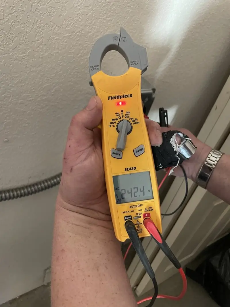 Voltage testing with clamp meter during Generator Installation in Green Acres